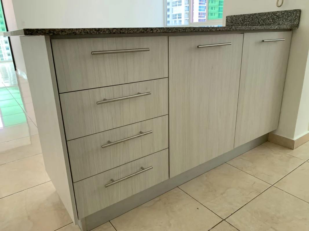 Kitchen cabinetry with granite countertops and tile floor at PH Sky Blue Panama