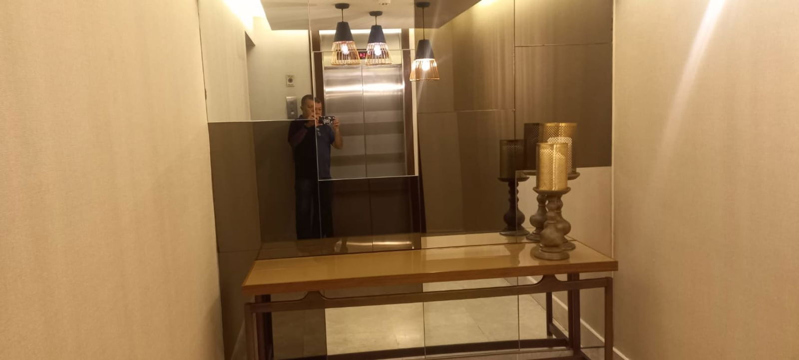 Elevator hall with large mirror console table Vista Verde Carrasquilla Panama