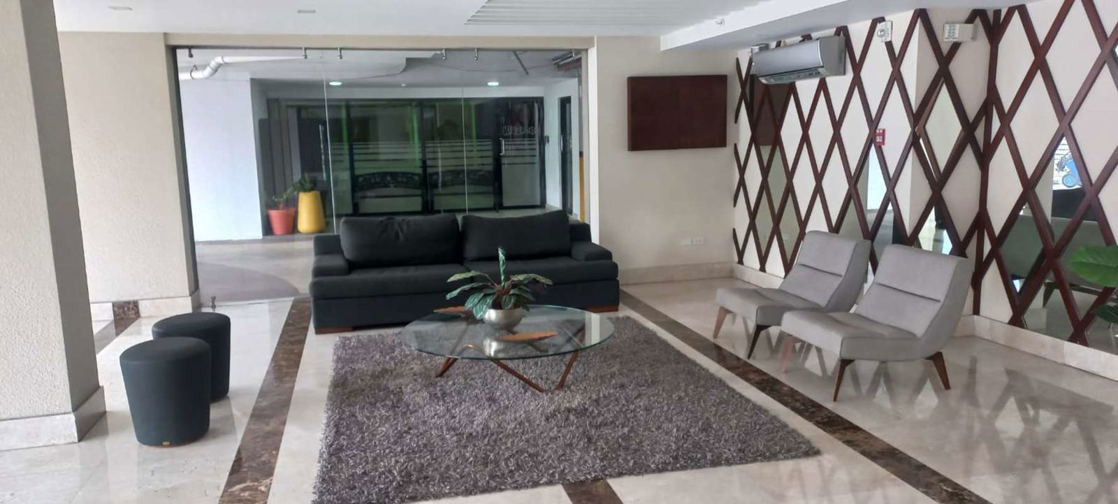 Reception lobby with sofas armchairs marble floor PH Vista Verde Panama