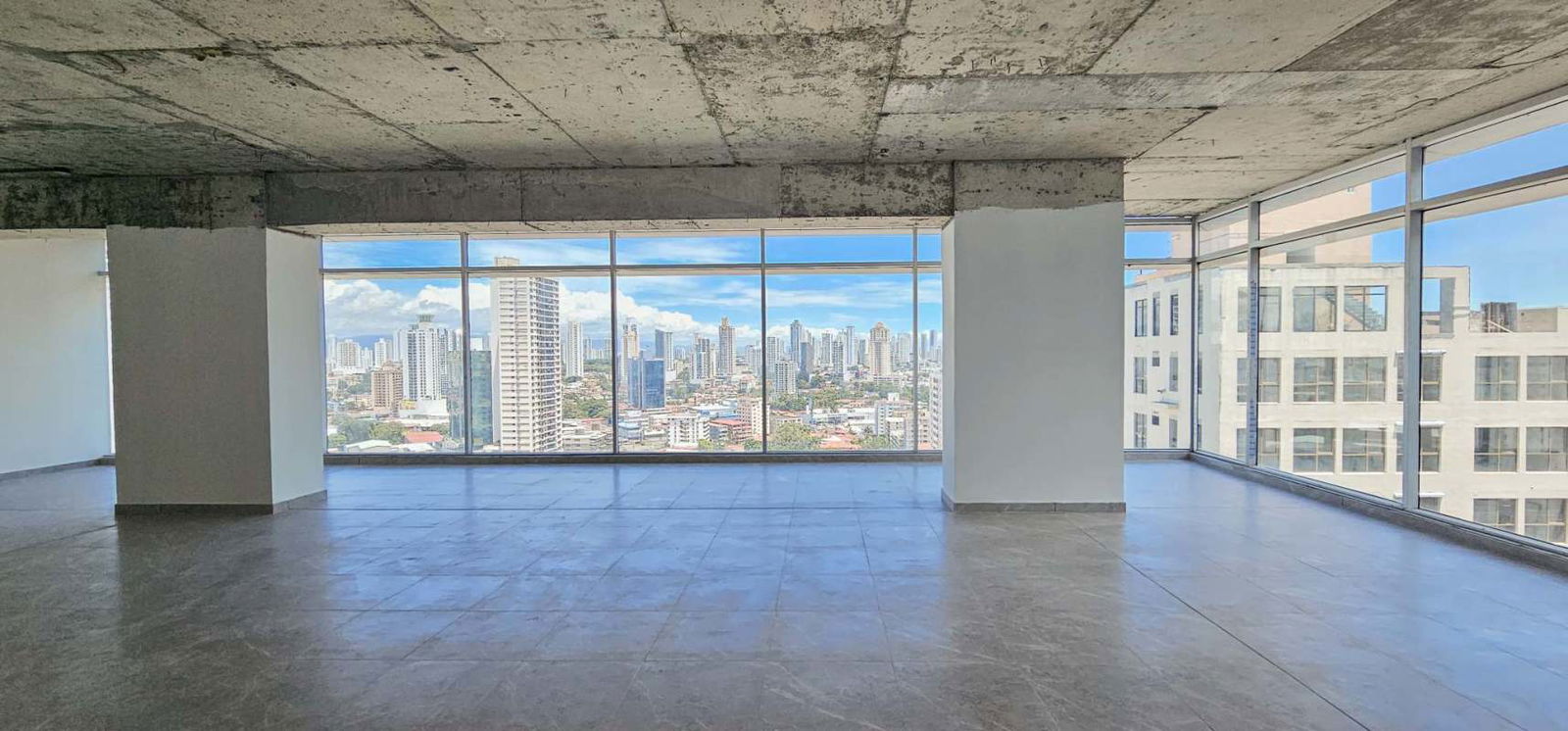Large unfurnished modern office with city views from Sortis Business Tower in downtown Panama