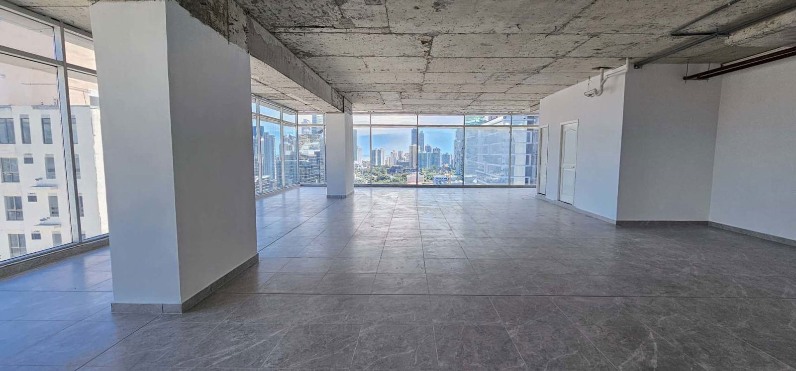 Interior unfurnished open workspace with city views Sortis Business Tower Obarrio Panama