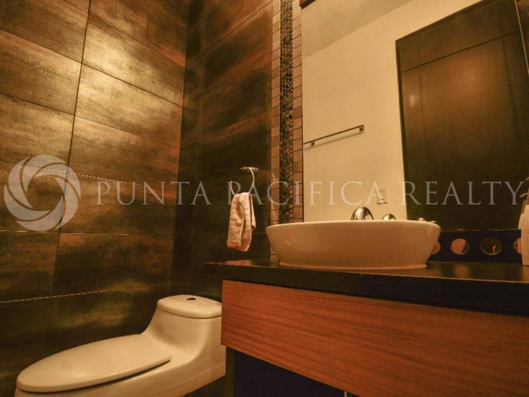 Contemporary tiled bathroom with vessel sink and glass enclosed shower PH Aquamare Panama City