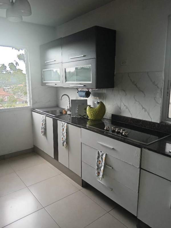 Spacious bright kitchen with granite countertops, modern cabinets in luxury house Condado del Rey Panama