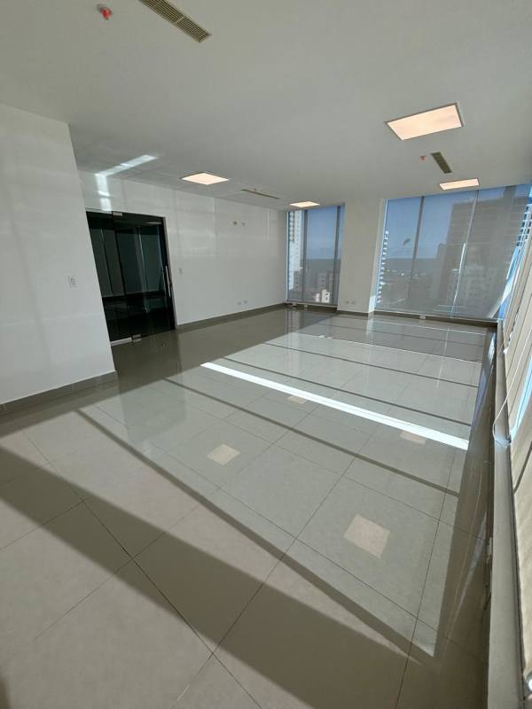 Large windows providing ocean and skyline views in spacious commercial office at PH Office 77 San Francisco Panama