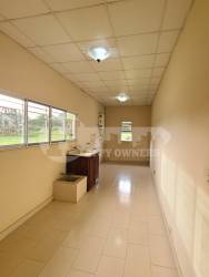 Spacious living room with neutral walls, tiled floor, recessed ceiling at Corpus Christi Los Santos Panama