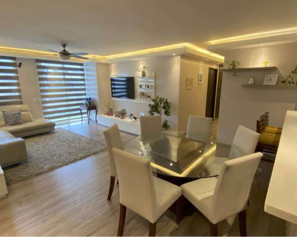 Modern apartment interior in PH Sunrise Tower featuring open dining and living with natural light