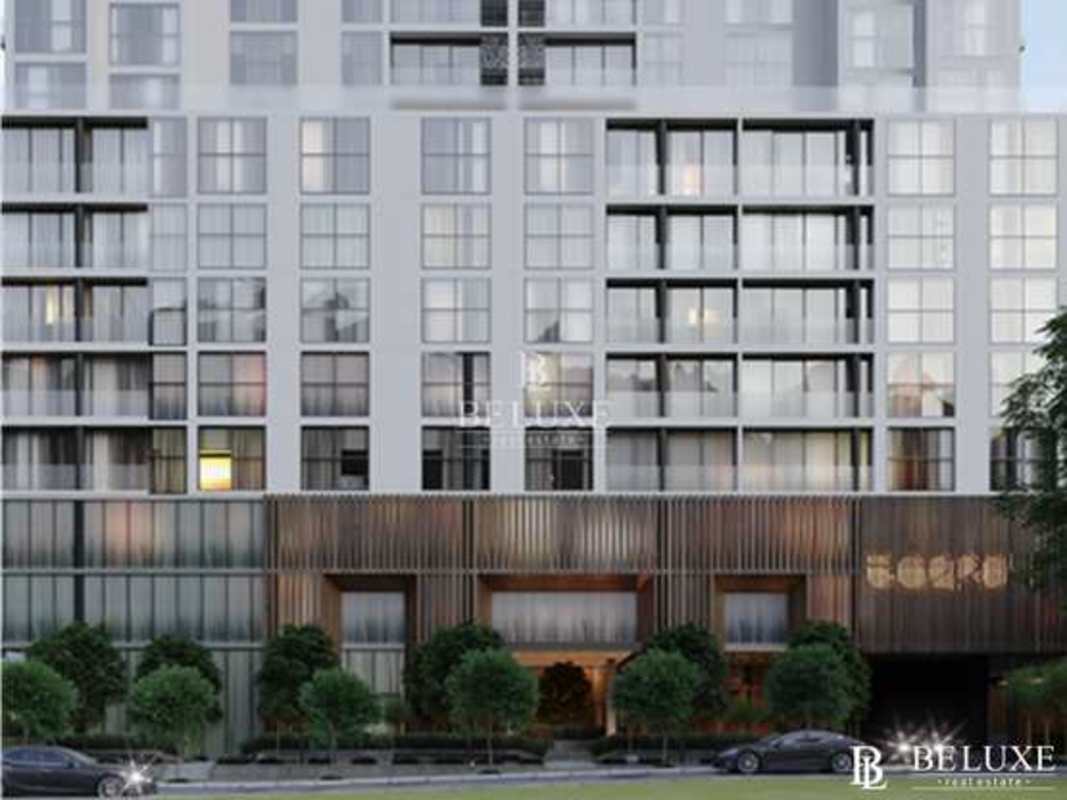 Open kitchen with quartz countertops white cabinets in PH 504 Coco del Mar