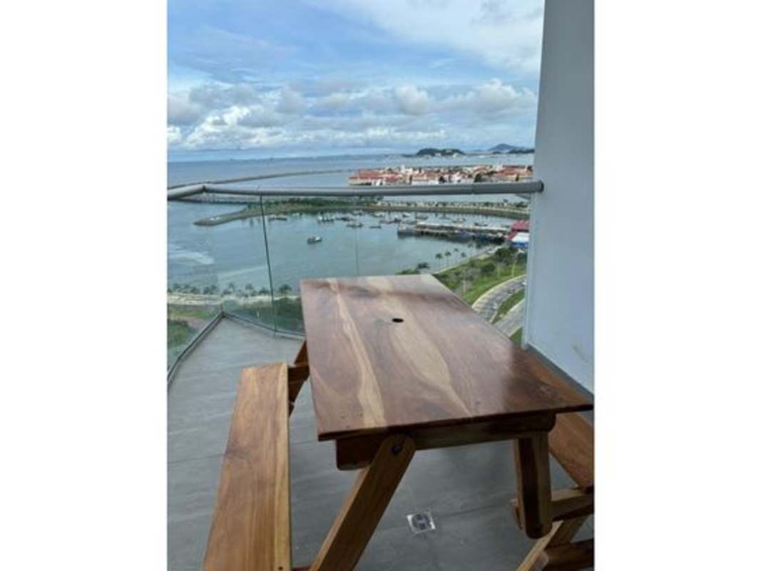 Modern living room with floor to ceiling windows ocean view marble floors at PH The Sands Panama City