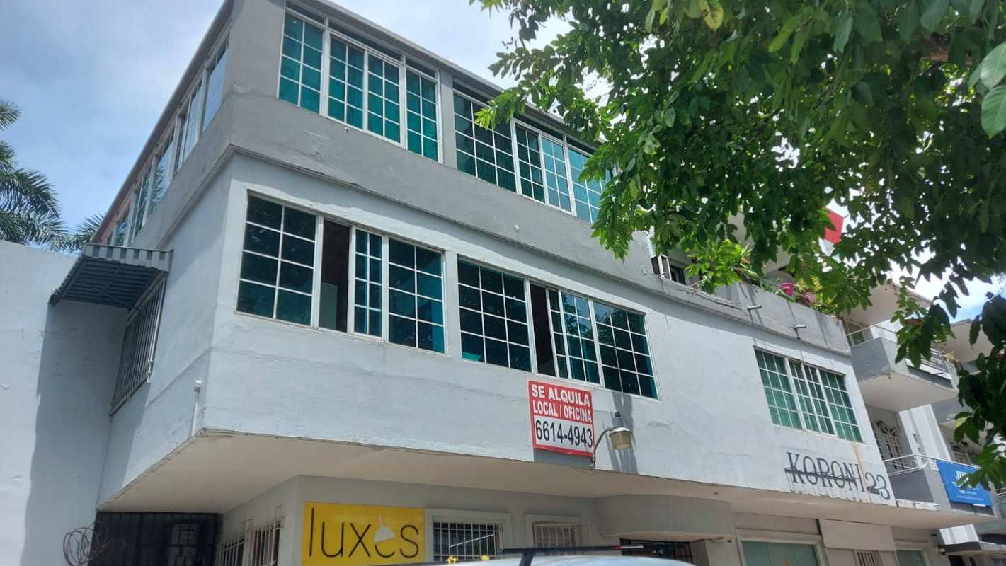 Empty commercial interior space with large windows and tiled flooring in Panama City