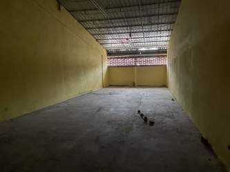 Industrial warehouse with roll-up truck door and electric panel in Colon Panama