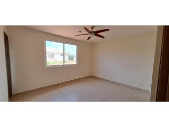 Bright modern kitchen with upper cabinets, stove and tiled backsplash rental house Panama Pacifico