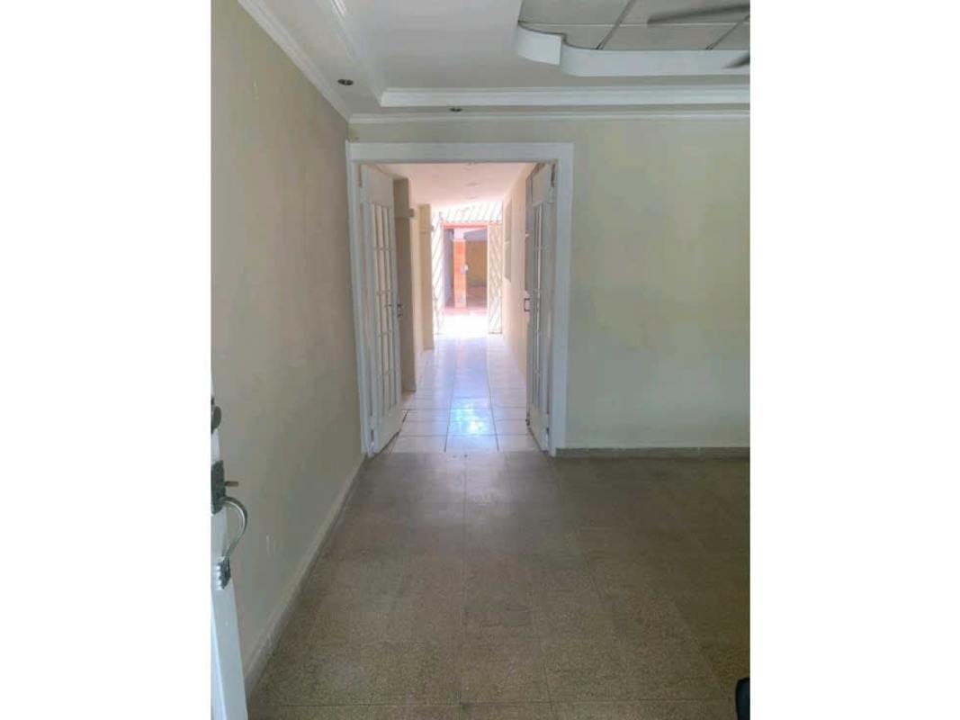 Wide hallway with beige tiles and natural lighting Villa Lucre house Panama
