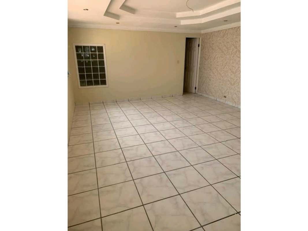Spacious living room with recessed ceiling and tile floors Villa Lucre house Panama