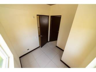 Modern bathroom double sink vanity bathtub large window in Costa Blanca Villa Panama