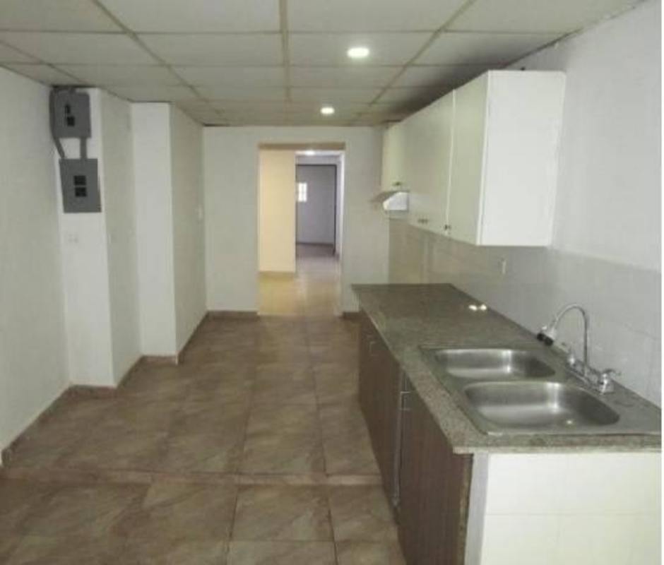 Functional kitchen with granite countertops and tile backsplash house in Carrasquilla Panama City