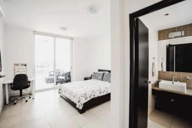 Compact modern kitchen with appliances at Founders Playa Blanca beachfront condo Panama