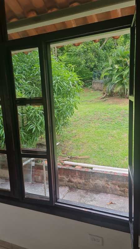 Window view to green private garden in Albrook house rental Panama City