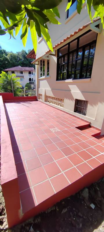 Living room with arched windows and modern furniture in Albrook rental home