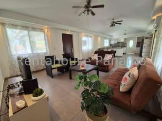 Large covered patio with ceiling fan and garden view beach home for sale Coronado Panama
