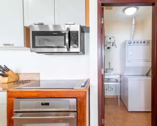 Master bedroom with balcony, ceiling fan, split AC, whirlpool bathtub, ocean and mountain views at PH Coronado Golf
