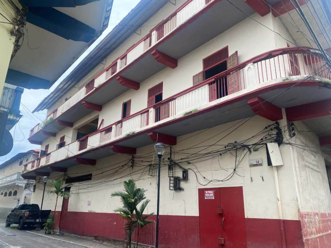 Secured gated alleyway between multi-story colonial-era buildings Casco Viejo Panama