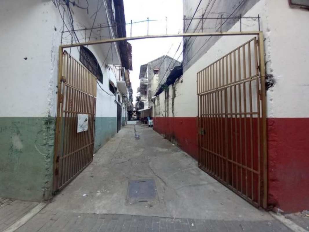 Colonial street view framed by multi-story historic buildings with balconies Casco Viejo Panama