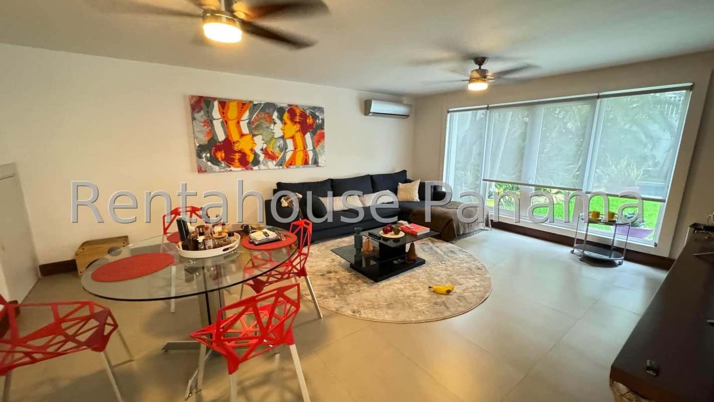Bright open living room with large windows AC and modern decor Obarrio Panama
