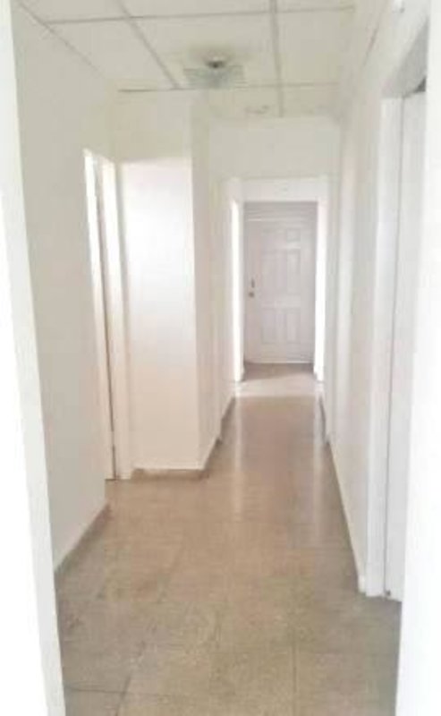 Bright hallway with white walls, tile flooring inside house Tierra Alta Villa Lucre Panama