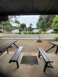 Interior of grocery store with shelves stocked gas cylinders refrigerator cash counter Bugaba David Chiriqui Panama
