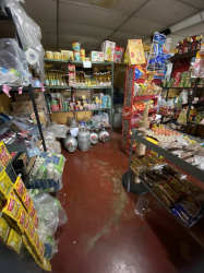 Interior storage room with shelves stocked with packaged goods commercial retail Bugaba David Chiriqui
