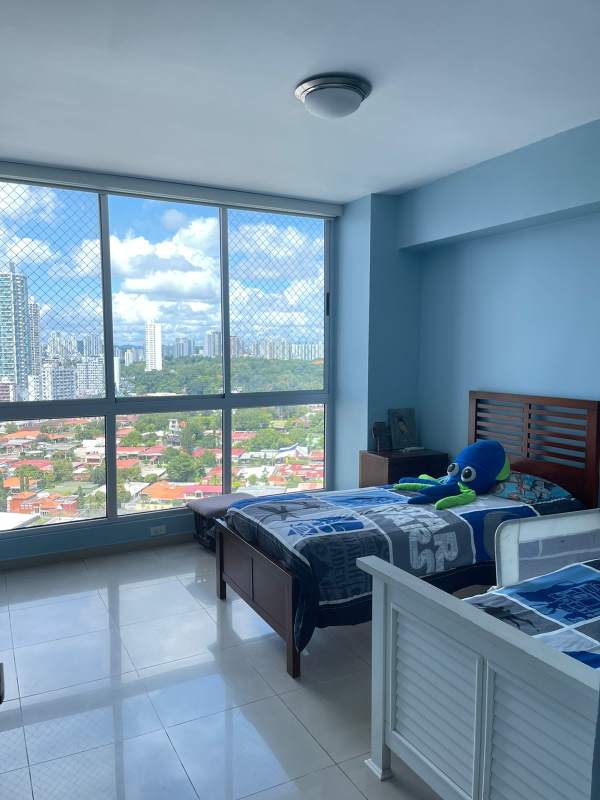 Bedroom with large windows, cityscape view, and tile flooring PH Vision Tower Panama