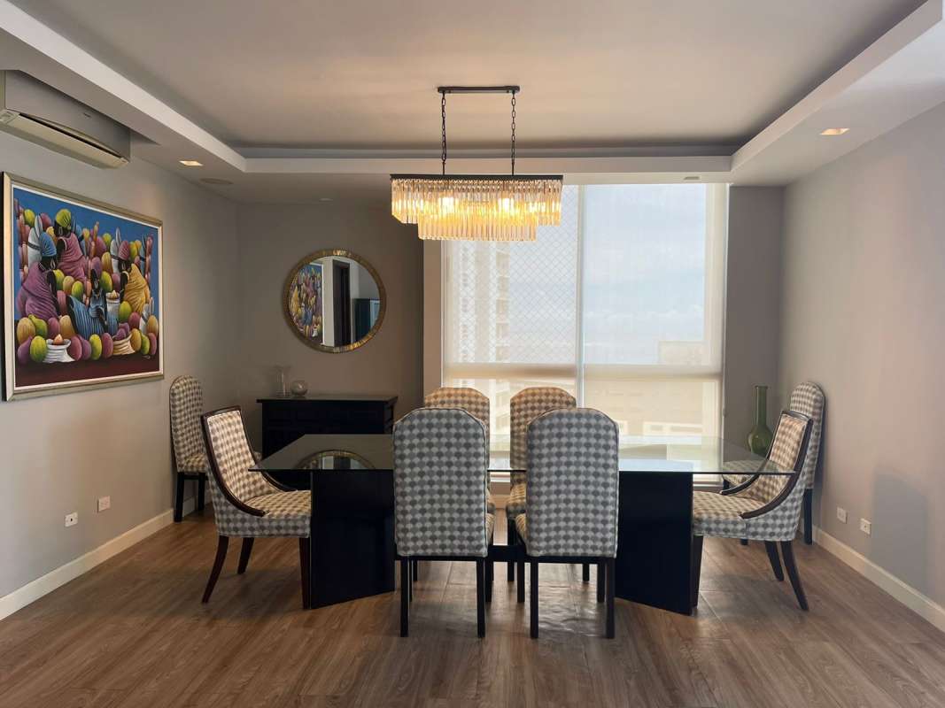 Contemporary dining area with glass table and ocean views at PH Vision Tower Coco del Mar Panama City