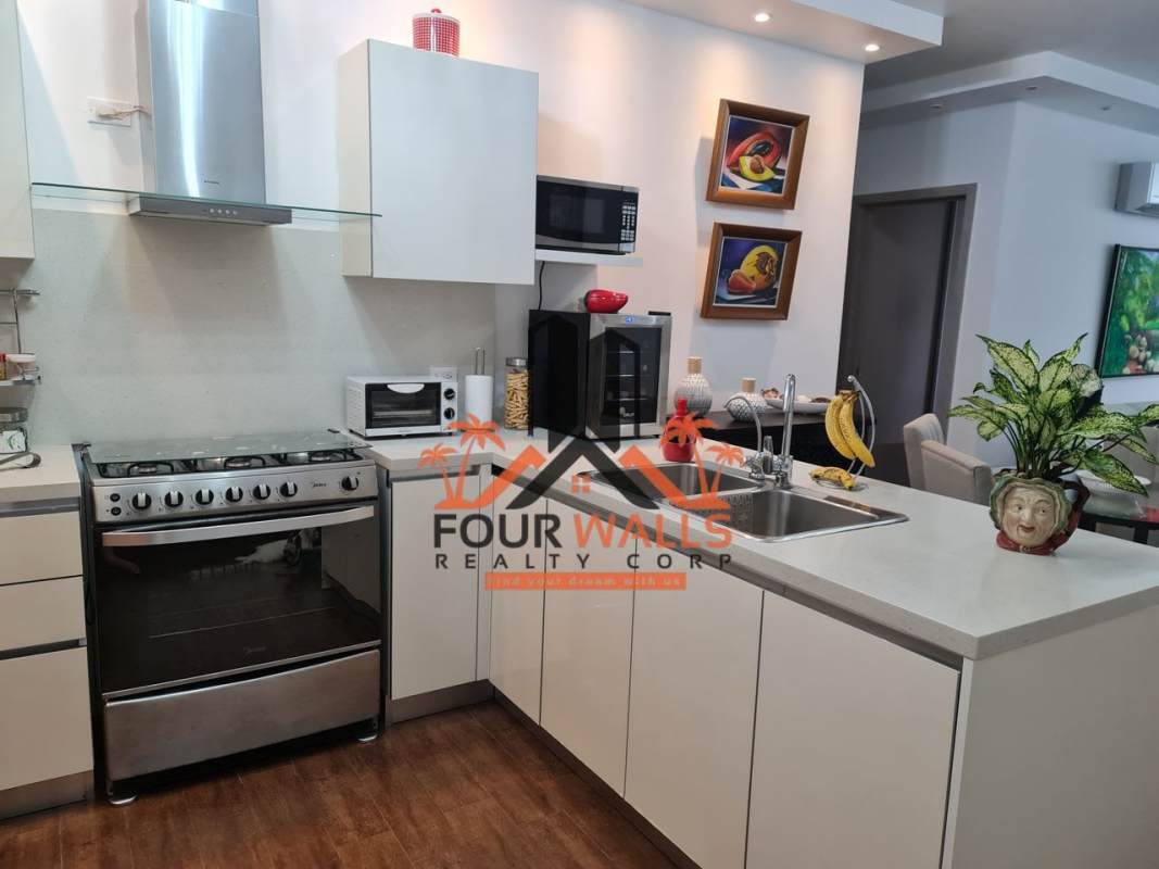 Fully equipped modern kitchen with appliances white cabinets PH Costamare Costa Sur Panama