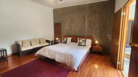 Open concept luxury living room with modern furniture at Coronado beach villa Panama