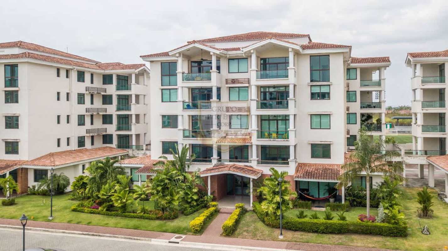 Minimalist kitchen with white cabinetry, stainless appliances, tile flooring in PH Costamare