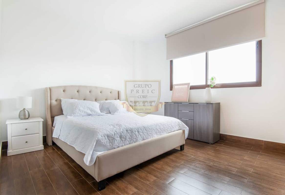 Covered terrace balcony with open garden and community view in PH Costamare Panama