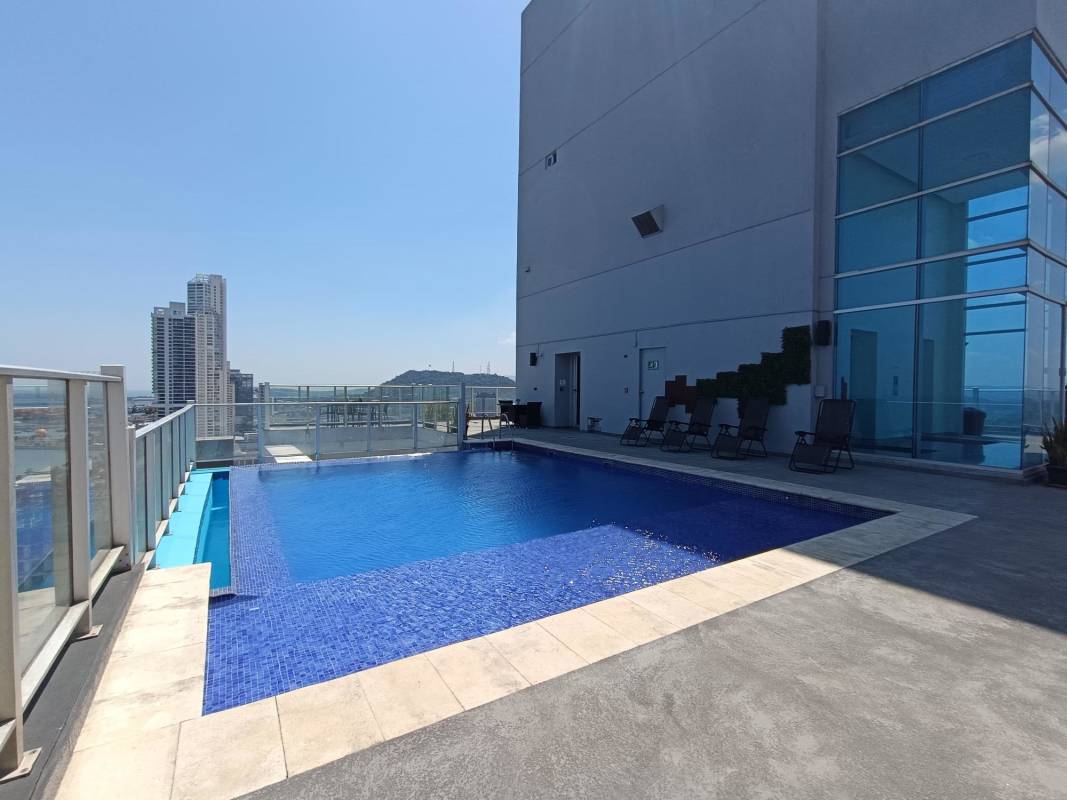 Residents social room with pool table, lounge seating and TVs at PH Vista Balboa Panama