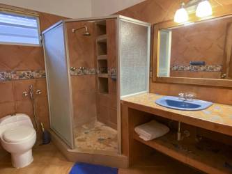 Spacious bedroom with large windows and tile flooring in Coronado Panama property for sale