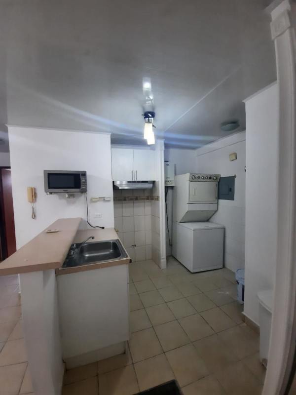 Small kitchen with microwave, washer dryer combo in PH Roca Park Panama