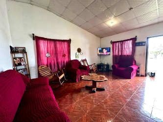 Functional kitchen in Volcán duplex with wood cabinets and gas stove.