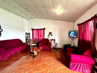 Cozy bedroom with tiled floor, window, garden views at mountain duplex in Volcán Panama