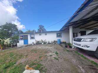 Bright tiled living area with arches and windows in Volcán Panama
