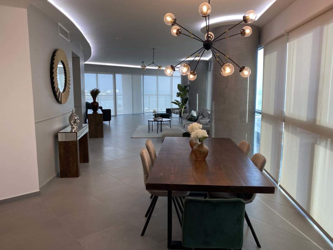 Modern furnished master bedroom with oceanfront balcony Panama City Yacht Club Tower