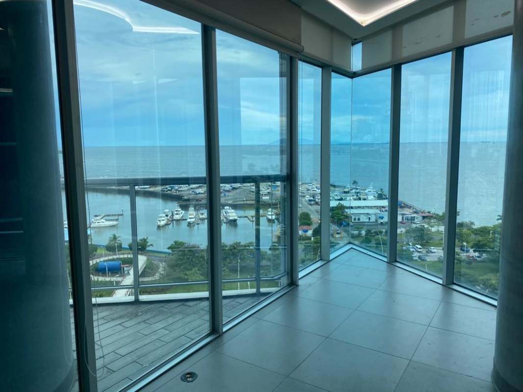 Elegant dining space with ocean marina skyline views at Yacht Club Tower Panama City