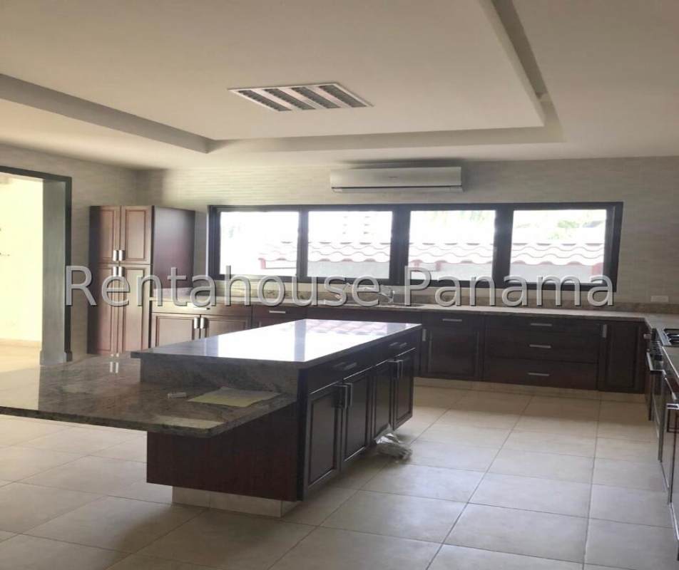 Modern bright living room with marble floors, large windows overlooking garden in luxury house Panama