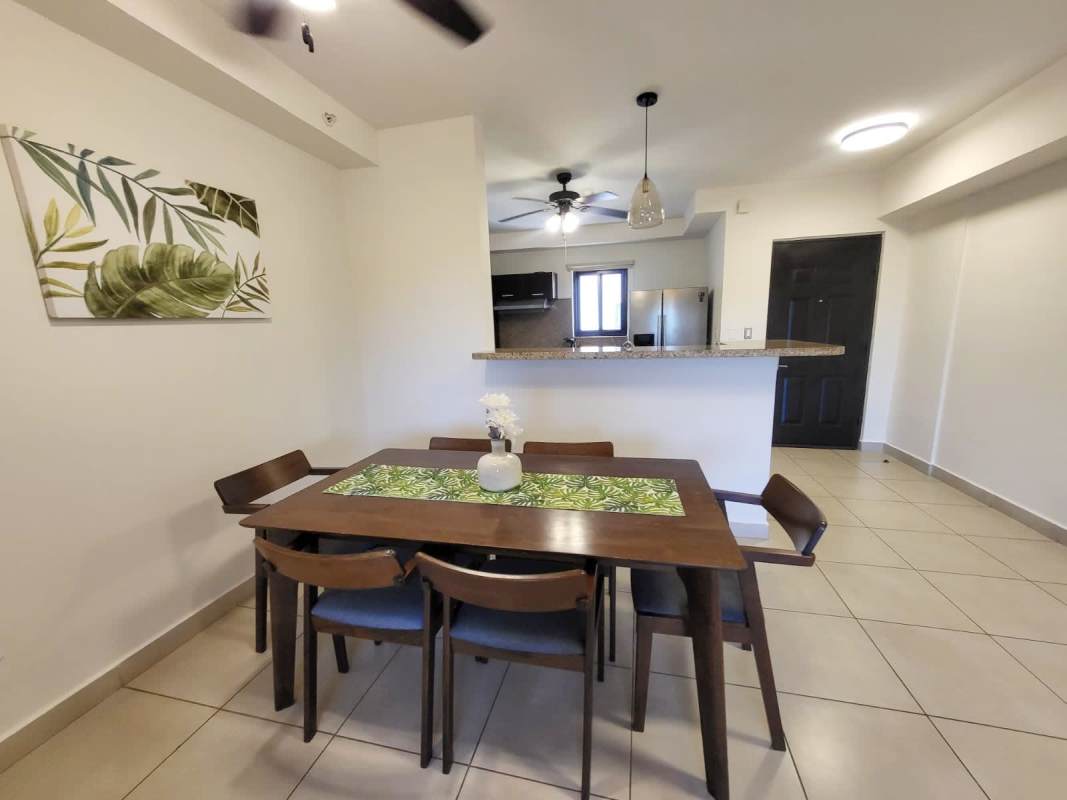 Dining area with kitchen featuring granite countertops at Embassy Club Clayton