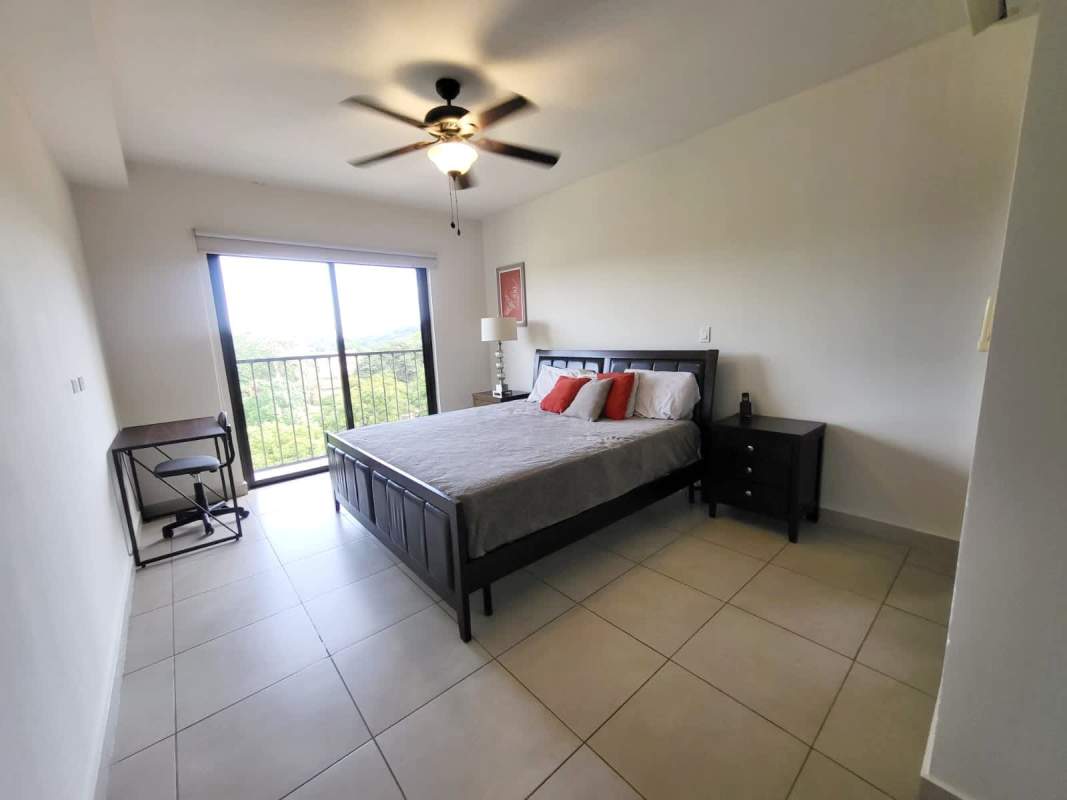 Primary bedroom with large balcony sliding doors Embassy Club Clayton Panama