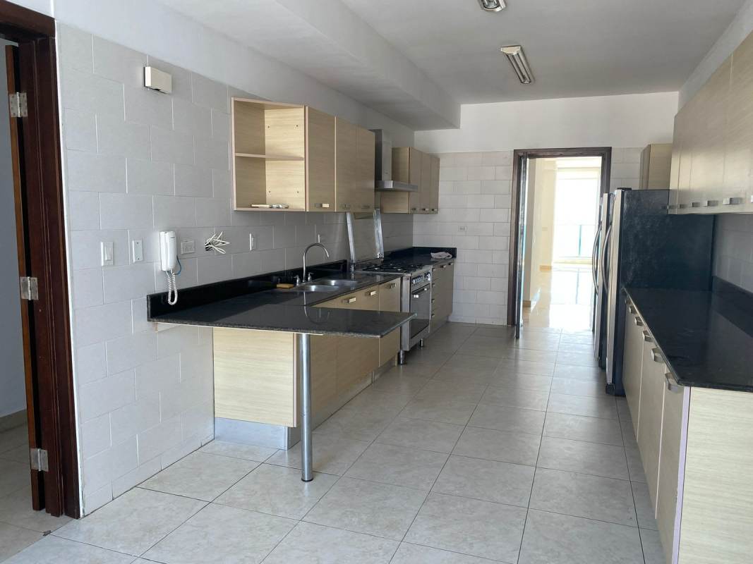 Modern luxury kitchen with granite counter stainless appliances and city views PH Marabierto Panama