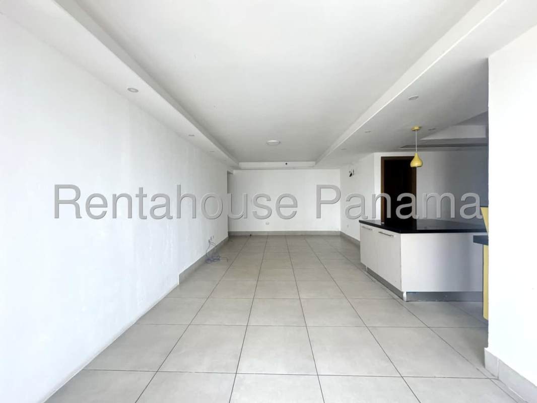 Spacious living room with tile floors and large windows in PH Park City apartment Obarrio Panama