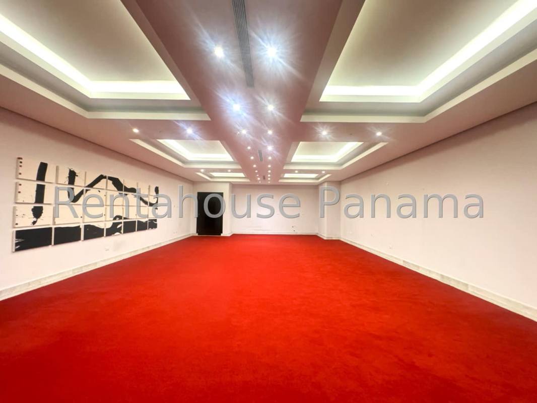 Covered terrace lounge with seating and city skyline views at PH Park City